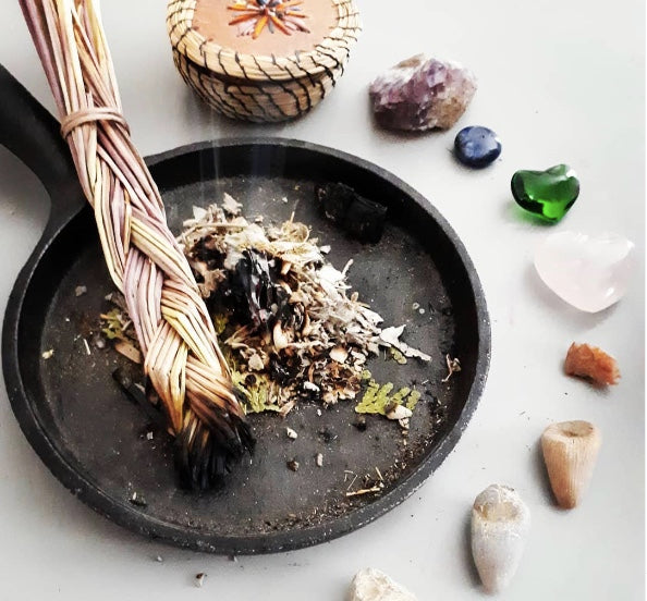 Indigenous medicines and Earth stones on a white background.